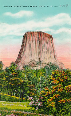 1931 postcard of Devils Tower, Wyoming, a shallow intrusion that formed columnar jointing as it cooled.
