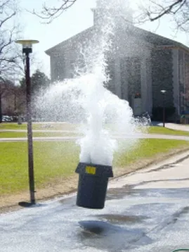 Explosion of water out of a trash can