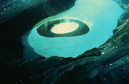 Clear blue lake with a cinder cone in the middle