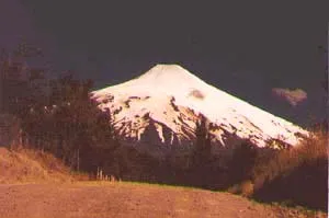Villarrica topped with snow from a distance