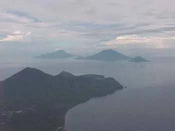 Mt. Jailolo in foreground, looking south across the strait to (from right to left) Hiri, Gamalama (Ternate), and Tidore. 