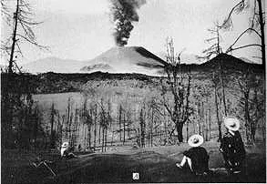 Black and white view of volcanic eruption in the distance