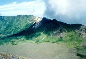 The upper slopes of Asama with the caldera wall beyond. Note person for scale in lower left.