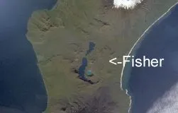 Satellite imagery of Fisher Island, illustrating its terrain and the expanse of the adjacent ocean.