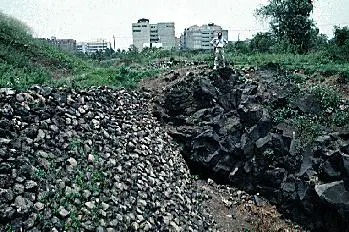 One of the locations of lava flow and civilization contact. The overlying lava flow was detonated with explosives in certain areas to generate access to the buried remains of Cuicuilco. (Photo from http://www.whaton.uwaterloo.ca)